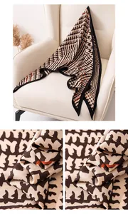 Detailed view of the soft vintage geometric pattern and fabric texture of the shawl