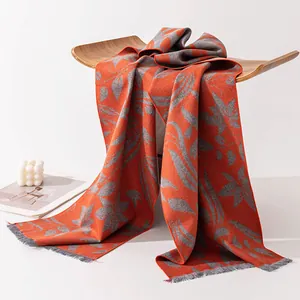 Elegant double-sided mulberry silk scarf with orange leaf pattern for autumn and winter.