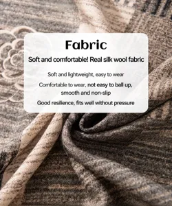 Macro detail of luxurious silk wool scarf fabric showing soft texture and stripes.