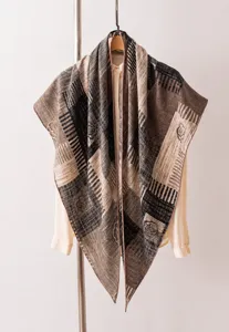 Close-up detail of luxury mulberry silk and wool scarf with elegant striped floral patterns