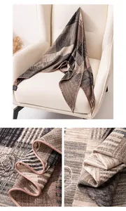 Detail of hand-rolled edges on a silk-wool blend striped triangular scarf