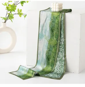 Detail view of the impressionist green meadow painting on a double-sided silk long scarf