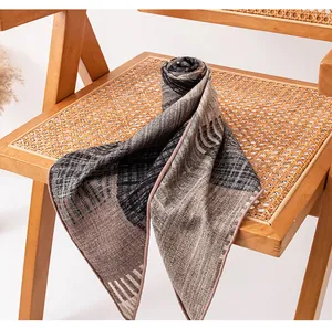 Detailed view of handmade silk wool triangle scarf with elegant striped patterns