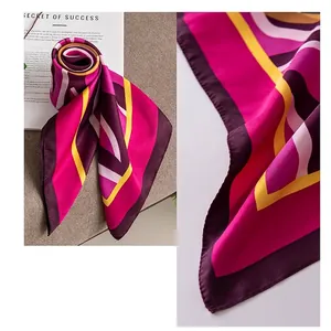 Elegant 90cm square silk scarf for women with vibrant pink geometric patterns.