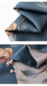 Detail view of double-layered mulberry silk scarf with vintage rose print and silk knots