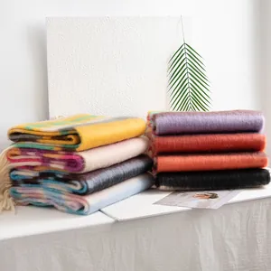 Soft colorful checkered winter scarves in a variety of vibrant colors and bold patterns