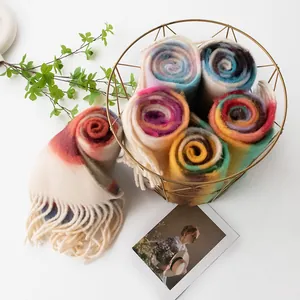 Soft colorful rainbow plaid fuzzy scarf with tassels displayed in a stylish golden basket