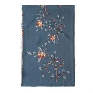 Elegant mulberry silk scarf with double-layered rose floral print in teal blue.