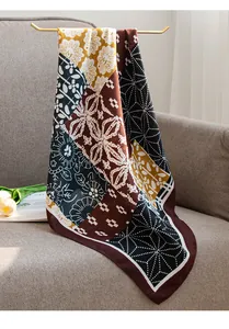 Detailed view of a pastoral cotton linen square scarf with patchwork floral patterns.