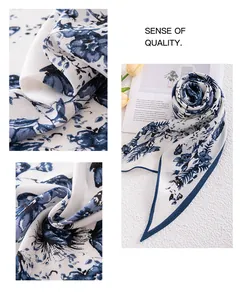 Detailed texture of blue floral printed triangular silk scarf accessory