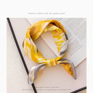 Elegant mulberry silk square scarf with yellow and grey abstract pattern, knotted style
