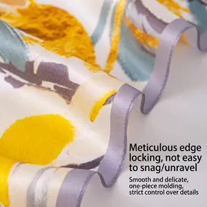 Detail shot of the delicate overlocked edge on a floral mulberry silk neckerchief.