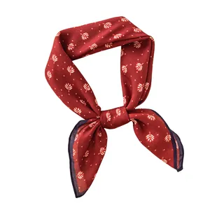 Elegant red square scarf with white leaf and dot patterns for professional styling
