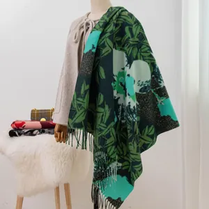 Detail view of elegant green leaf print imitation cashmere shawl with tassel fringe