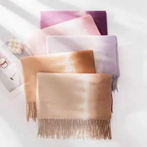 Soft cashmere-feel tie-dye scarves with elegant fringe detailing in various autumn colors