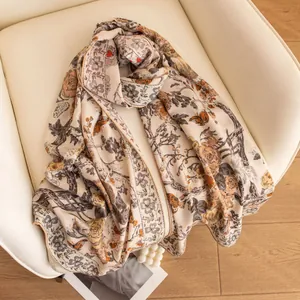 Detailed view of exotic floral print on silk wool scarf shawl in a lifestyle setting
