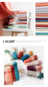 Detailed macro view showing a collection of soft gradient ombre scarves with fringe tassels