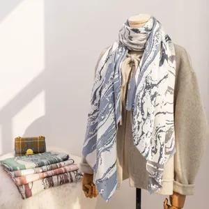 Elegant blue marble print cashmere-feel winter scarf for women providing warmth