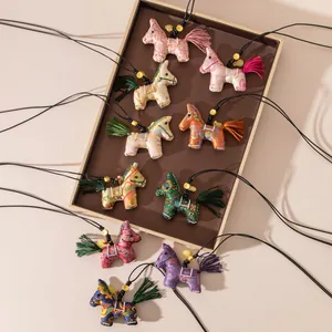 Macro view of colorful silk horse necklaces in traditional Chinese Song Brocade style