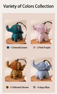 Detailed view of four colorful handmade silk elephant charms with intricate patterns.