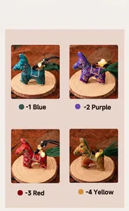 Traditional Chinese zodiac horse pendants in blue, purple, red, and yellow colors.
