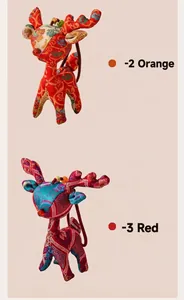 Detail showing handmade silk deer pendants in vibrant orange and red colors.