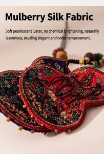 Close-up of traditional Chinese embroidered gourd pendant made of mulberry silk