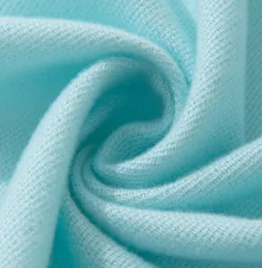 Macro view of soft light blue imitation cashmere scarf fabric texture and weave