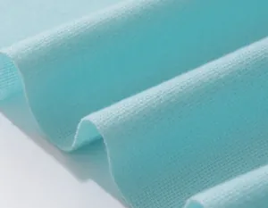Detailed view of the fine knit pattern and soft fabric of this sky blue winter scarf
