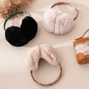 Detailed view of plush Rex rabbit fur earmuffs in three colors with patterned headbands