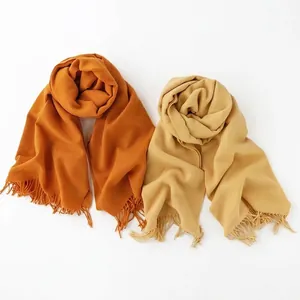 Elegant soft imitation cashmere scarf for women in solid orange and beige with fringes
