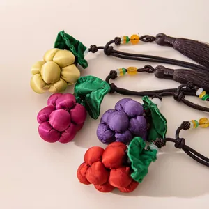 Handmade mulberry silk grape pendants featuring intricate leaf details and tassels