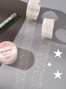 Close-up of translucent polka dot PET tape with glitter for journaling and crafts.