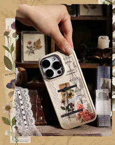 Detailed view of vintage botanical stickers and scientific diagrams on a phone case