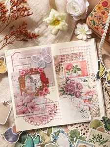 Close-up of vintage floral and butterfly stickers on a creative scrapbook page