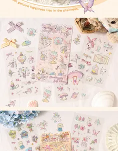 Detailed view of whimsical pastel PET journal stickers with floral and butterfly motifs