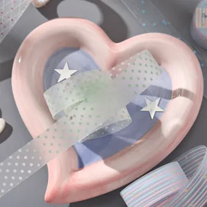 Dreamy translucent polka dot PET washi tape for journaling displayed on heart tray