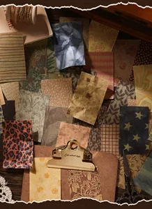 Macro view of vintage patterned scrapbooking material paper on a creative workspace