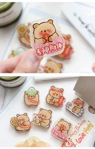 Close-up of adorable cartoon bear acrylic clips with Chinese study motivation text