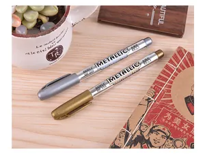 Close-up of gold and silver metallic craft pens for card making and signatures