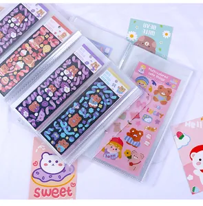 Detailed view of high-capacity sticker storage album with clear insert pockets