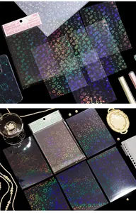 Close-up of holographic laser PET heart and star stickers for scrapbooking journals