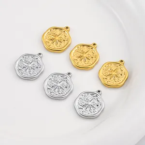 Detailed view of hammered stainless steel pendants with star motif in gold and silver