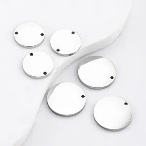 Detail of mirror polished stainless steel round pendants with single and double holes