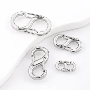 Detail view of polished stainless steel S-shaped spring carabiners in various sizes