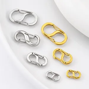 Detailed view of S-shaped stainless steel spring buckles in gold and silver finishes