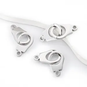 Detailed macro view of polished stainless steel handcuff pendants for jewelry making