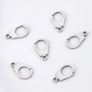 Macro view of polished stainless steel handcuff charms for DIY jewelry making accessories.