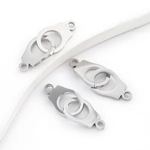 Macro view of polished stainless steel handcuff connectors for DIY jewelry making