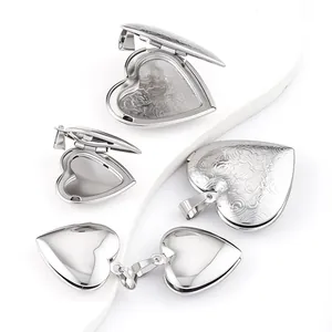 Detail view of heart-shaped stainless steel lockets with floral and polished finishes